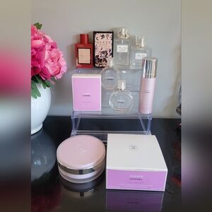 Empty perfume bottles, cream container & body spray can